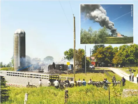  ?? [COLIN MERLIHAN] ?? The barn at the Manser Road property was already fully engulfed when firefighte­rs arrived on scene Saturday afternoon.