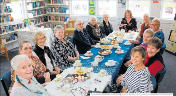  ??  ?? Tararua district mayor Tracey Collis at the head of the table with councillor Alison Franklin in the foreground, hosting a high tea in Pahiatua to celebrate the 125th anniversar­y of women’s suffrage in New Zealand.
