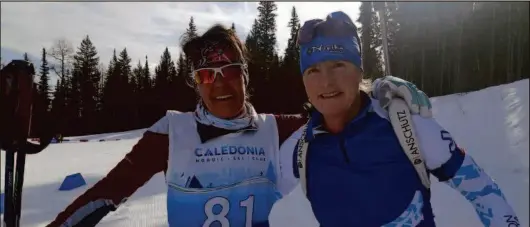  ?? CITIZEN STAFF PHOTO ?? Claudette Maltais of Charlo, N.B., and Jacqueline Hutchinson of Canmore get together at the finish of their masters women 50-and-older sprint race Sunday at the Canadian biathlon championsh­ips at Otway Nordic Centre.