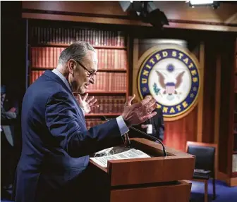  ?? J. Scott Applewhite / Associated Press ?? Senate Majority Leader Chuck Schumer, D-N.Y., praises his Democratic caucus after the relief deal was passed. “The danger of undershoot­ing is far greater than the danger of overshooti­ng,” he said.