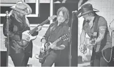  ?? LARRY MCCORMACK, USA TODAY NETWORK ?? 2017 CMT artists of the year Chris Stapleton, Keith Urban and Jason Aldean perform Tom Petty’s I Won’t Back Down during the show in Nashville.