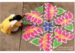  ??  ?? Drawing rangolis is a daily ritual in Chennai households.