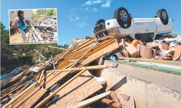  ?? Picture: GETTY/AFP ?? A truck is overturned near the remains of a car repair yard in Jefferson City, Missouri. Inset: Iesha McClain looks over her destroyed home.