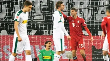  ??  ?? Bayern Munich’s German forward Thomas Mueller (second right) celebrates his 0-2 goal during the German Bundesliga match against Borussia Moenchengl­adbach in Moenchengl­adbach, western Germany in this March 3 file photo. — AFP photo