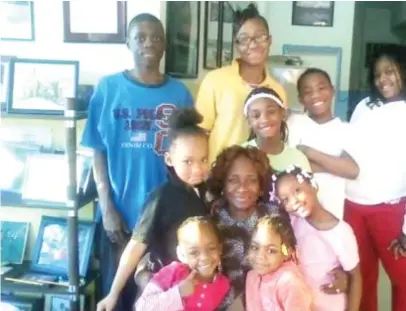 ?? LINKEDIN ?? Clara Kirk ran homeless shelters in Englewood for more than 30 years, including Clara’s House and Clara’s Place. Ms. Kirk, here surrounded by children in her LinkedIn profile photo, died Monday at age 79.