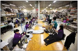  ?? AP/IVAN PIERRE AGUIRRE ?? Workers manufactur­e car dashboard mats at a factory in Ciudad Juarez, Mexico, in 2013. Autoworker­s in Mexico take home as little as $50 per week.