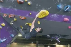  ??  ?? Samuel DeSantis of Warren, Ohio, boulders at ASCEND.