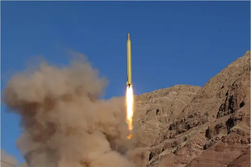  ?? (Reuters) ?? AN IRANIAN missile launches from a test site.