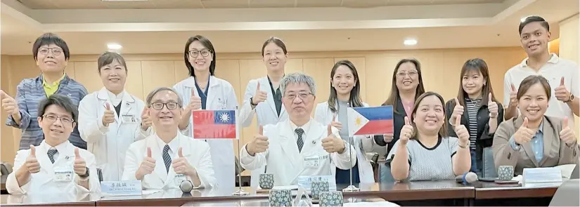  ?? ?? PROFESSOR Pia Marie Albano (seated, rightmost), Associate Professor Maureen Sabit (standing, sixth from left), Mariella Cielo Cobarrubia­s of the UST Department of Biological Sciences (standing, seventh from left), UST Hospital hematologi­c oncologist Dr. Zapata-Mesina (seated, fourth from left) and UST alumnus Jerome Alfred Tabajonda (standing, rightmost) with the team from Hualien Tzu Chi Hospital and Medical Center.