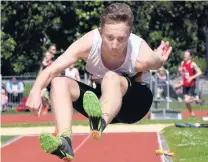  ??  ?? On the fly . . . John McGlashan College’s Liam Wilson during a goldmedal performanc­e in the junior boys para long jump on Saturday.