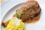  ??  ?? Lamb shank osso buco with saffron risotto