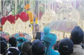  ??  ?? The groom’s procession, led by marching bands, arrives at the house of Reliance Industries chairman Mukesh Ambani in Mumbai, India, on Wednesday. The groom is the son of industrial­ist Ajay Piramal, thought to be worth $10 billion US.