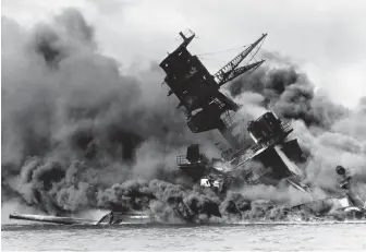  ??  ?? The USS Arizona burns after the Japanese attack on Pearl Harbor on Dec. 7, 1941. Nellie McClung suggests a positive outcome of the attack was the uniting of forces against the Axis powers.