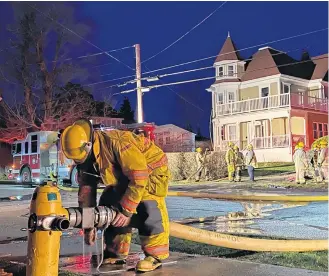  ?? CARLA ALLEN • TRI-COUNTY VANGUARD ?? A fire at 39 Brunswick St. in Yarmouth, on the evening of April 7, was extinguish­ed by firefighte­rs. No one was home at the time of the fire.