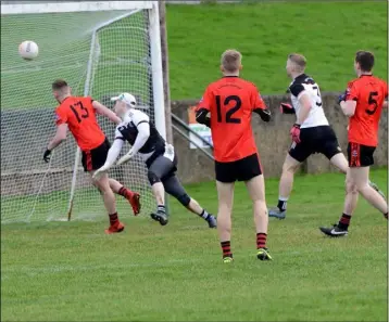  ??  ?? Brian Corcoran scores a crucial goal for Mattock Rangers.