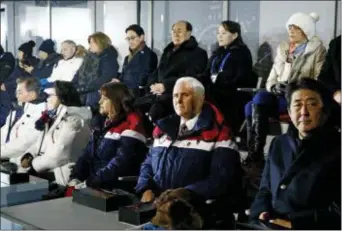  ?? PATRICK SEMANSKY — THE ASSOCIATED PRESS ?? Vice President Mike Pence, second from bottom right, sits between his wife, second lady Karen Pence, third from left, and Japanese Prime Minister Shinzo Abe at the opening ceremony of the Winter Olympics.