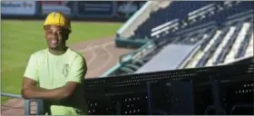  ?? BRAD HORRIGAN — HARTFORD COURANT VIA AP ?? Warren Wells poses for a photo at Dunkin’ Donuts Park baseball stadium, he helped build last year, in Hartford, Conn. Through carpentry skills developed in the Youth Build program, Wells overcame some troubles early in his life and has joined the...