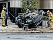  ?? CHRIS FARINA/DETROIT NEWS ?? Rescue personnel work a crash site in Detroit on Tuesday. Research shows human decisions cause most crashes.