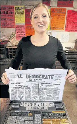  ??  ?? LEFT Journalist and director of the ‘Democrate de L’Aisne’ Eleonore Dufrenois poses with the weekly newspaper.