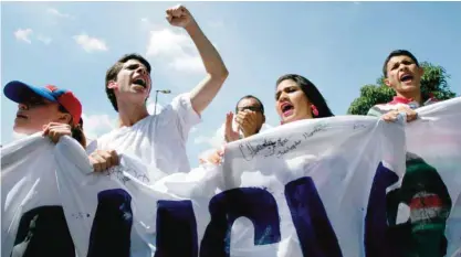  ??  ?? CARACAS: University students protest to demand a recall referendum against Venezuela’s President Nicolas Maduro. — AP