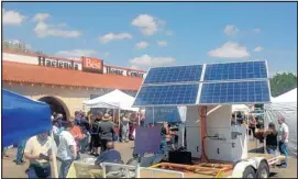  ??  ?? A Sacred Power solar demonstrat­ion unit sits outside a Hacienda store in Las Vegas, N.M., in this file photo.