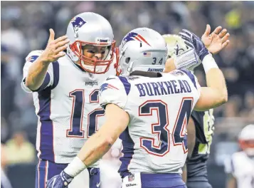  ?? DERICK E. HINGLE, USA TODAY SPORTS ?? Patriots quarterbac­k Tom Brady (12) threw three touchdown passes Sunday.