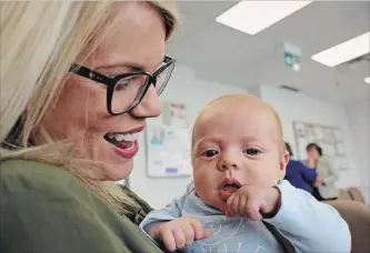  ?? LISA RUTLEDGE CAMBRIDGE TIMES ?? Cambridge mother Kara Racco and 11-week-old son Hunter were on hand for Two Rivers Family Health Team’s announceme­nt as a “baby-friendly” facility, the first family health team to receive the designatio­n in Ontario.