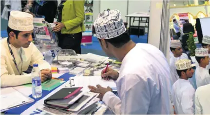  ?? Saleh Al Shaibany for The National ?? Jobseekers wait for their turn at a job fair held at the Oman Convention Centre in Muscat this week.