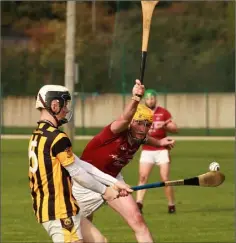  ??  ?? Dan Campbell clears as Colin Kennedy of Liam Mellows moves in.