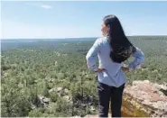  ?? FELICIA A. SALAZAR/U.S. DEPARTMENT OF THE INTERIOR VIA AP ?? Secretary of the Interior Deb Haaland looks out at the Sabinoso Wilderness in Las Vegas, N.M., on Saturday after accepting a land donation from the Trust for Public Land to the Bureau of Land Management.