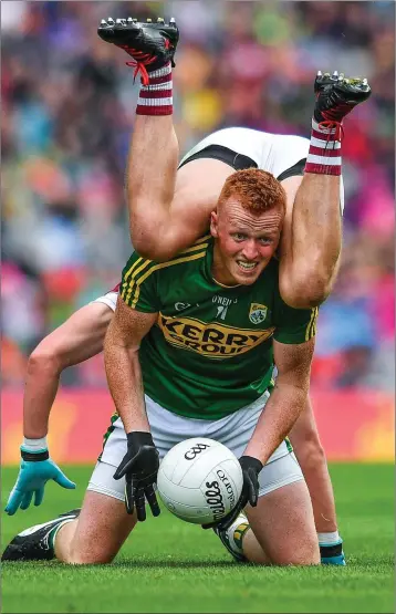  ??  ?? Johnny Buckley of Kerry is tackled by Gary O’Donnell of Galway during the All-Ireland quarter-final.