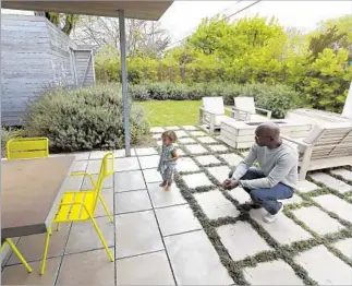  ??  ?? THE HOME spills onto an outdoor dining area. “That was what was so cool about the way Noah designed the house,” says Wilborn, with daughter Lake, “the outside is an extension of the house.”