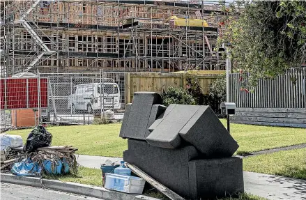  ?? RICKY WILSON, KATE NEWTON/STUFF ?? In Mā ngere’s Ventura St and Bede Pl, residents of the Kā inga Ora developmen­t like Diane Tieni, inset left, have laid salvaged possession­s outside to dry in the shadow of more developmen­ts that promise ‘‘New warm, dry homes are coming’’.
