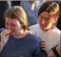  ?? AP PHOTO/BRYNN ANDERSON ?? Students grieve during a vigil at Pine Trails Park for the victims of the Wednesday shooting at Marjory Stoneman Douglas High School, in Parkland, Fla., Thursday, Feb. 15, 2018. Nikolas Cruz, a former student, was charged with 17 counts of premeditat­ed...