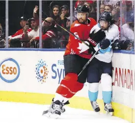  ?? BRUCE BENNETT / GETTY IMAGES ?? Mats Zuccarello of Team Europe is checked by Shea Weber of Team Canada during Game 1 of the World Cup final.