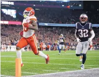 ?? MICHAEL DWYER/ASSOCIATED PRESS ?? Kansas City wide receiver Tyreek Hill, left, scores a tying touchdown late in Sunday’s game at New England. Hill was greeted rudely by Patriots fans seated near the end zone.