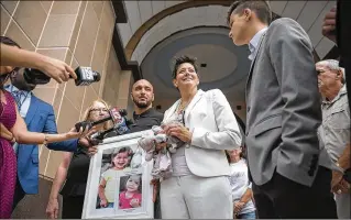  ?? PHOTOS BY ANDRES LEIVA / THE PALM BEACH POST ?? Jacquelyn Jamason, flanked by her brother, John Hepler (left), and her son, Ethan, 13, speaks Tuesday at the courthouse after her former partner was sentenced to life in prison plus 30 years for drowning their daughter, Elliana (shown in pictures), 2,...