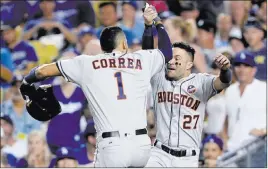  ?? David J. Phillip ?? The Associated Press Houston’s Carlos Correa and Jose Altuve rejoice after the final out of Game 2.