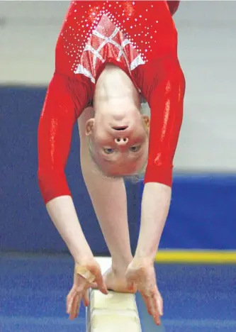  ?? CLIFFORD SKARSTEDT/EXAMINER FILES ?? Gymnast Katie Berry, 13, practises on the beam on Nov. 18 at Kawartha Gymnastics in preparatio­n to represent Team Ontario at a meet in Las Vegas from Jan. 11 to 15. She won the gold medal on beam and third place overall in the Level VII girls 14 and...