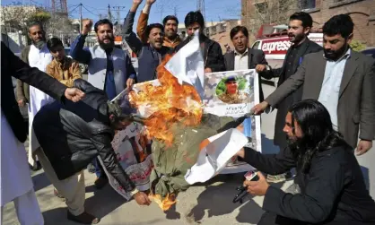  ??  ?? Pakistani protesters burn an effigy of Indian prime pinister Narendra Modi during a rally on Wednesday. ‘The prospect of a broker as ignorant and impatient as Mr Trump would be a cause for alarm rather than relief.’ Photograph: Muhammad Sajjad/AP