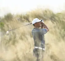  ?? Mike Ehrmann / Getty Images ?? Tiger Woods seems lost in the wilderness on his way to a 75, but found a silver lining to his round in the Bahamas.