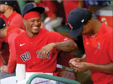  ?? MATT STONE — BOSTON HERALD ?? Ceddanne Rafaela, left, of the Boston Red Sox talks with Brayan Bello in the dugout before an Aug. 28 game against the Houston Astros at Fenway Park.