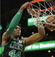  ?? AP ?? RIM RATTLER: Celtics center Robert Williams dunks against the Oklahoma City Thunder on Sunday.