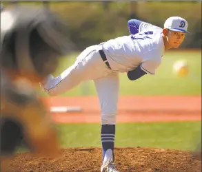  ?? Brian A. Pounds / Hearst Connecticu­t Media ?? Darien pitcher Henry Williams delivers to the plate during his 1-0 complete game shutout victory over Trumbull in the FCIAC quarterfin­als in Darien on Monday.