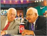  ?? Mike Stobe Getty Images ?? HELPED DEVELOP TALENT PIPELINE Ralph Avila, right, speaks to Tommy Lasorda at the 2010 MLB draft. Avila, who was an influentia­l executive and scout for the Dodgers, died Monday at 92.