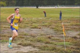  ?? The Sentinel-Record/Tanner Newton ?? DOMINANT FORCE: Lakeside’s Joseph Bariola dominates the course during the Garland County Invitation­al Saturday at Oaklawn Park. Bariola won the 2-mile race in 11:33, 47 seconds ahead of second place, and Lake Hamilton won the team title.