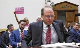  ?? JACQUELYN MARTIN / ASSOCIATED PRESS ?? CodePink co-founder Medea Benjamin holds up a sign that says, “Talks with North Korea not sanctions,” as Assistant Secretary of the Treasury for Terrorism and Financial Intelligen­ce Marshall Billingsle­a takes his seat to testify at a House Foreign...