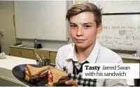  ??  ?? Tasty Jarred Swan with his sandwich