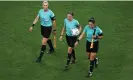  ?? Anadolu Agency/Getty Images ?? Neuza Back (left), Stéphanie Frappart and Karen Díaz leave the pitch after making history at the Al Bayt Stadium. Photograph: