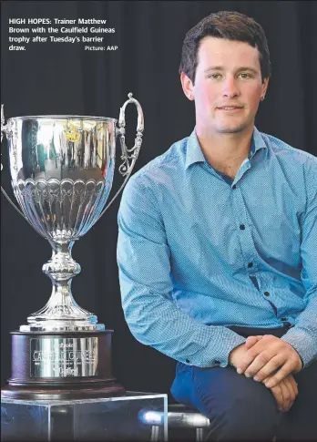  ?? Picture: AAP ?? HIGH HOPES: Trainer Matthew Brown with the Caulfield Guineas trophy after Tuesday’s barrier draw.